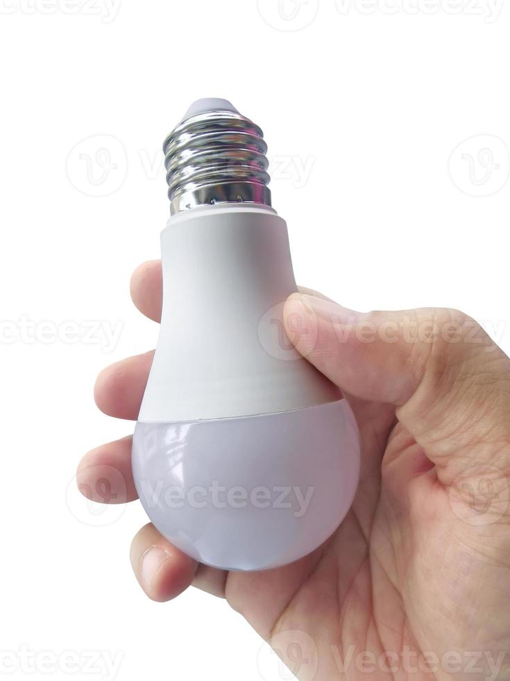 hand met gloeilamp geïsoleerd op een witte achtergrond foto