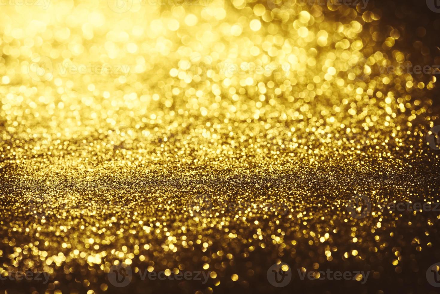 gouden glitter bokeh verlichting textuur wazig abstracte achtergrond voor verjaardag, jubileum, bruiloft, oudejaarsavond of kerst foto