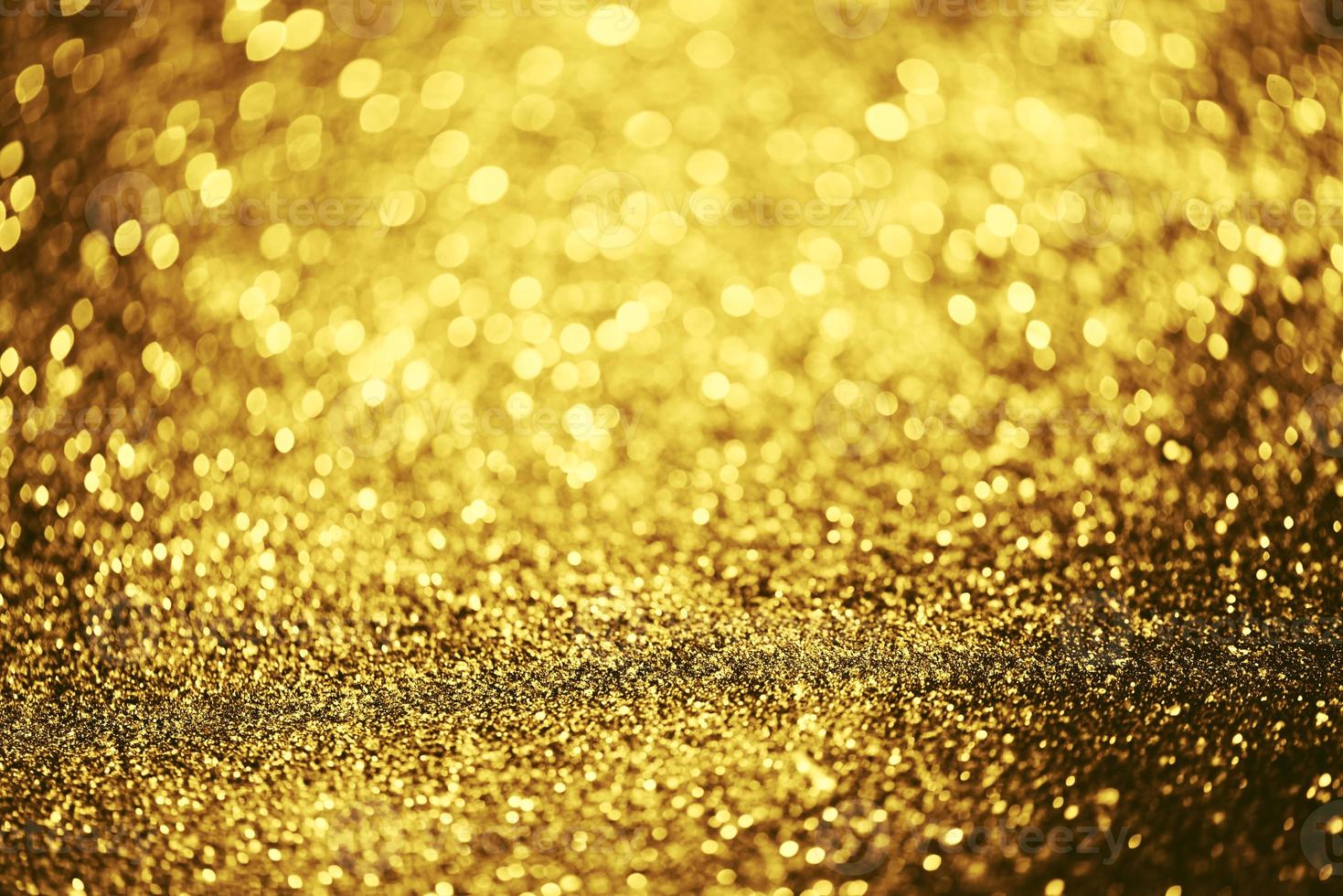 gouden glitter bokeh verlichting textuur wazig abstracte achtergrond voor verjaardag, jubileum, bruiloft, oudejaarsavond of kerst foto