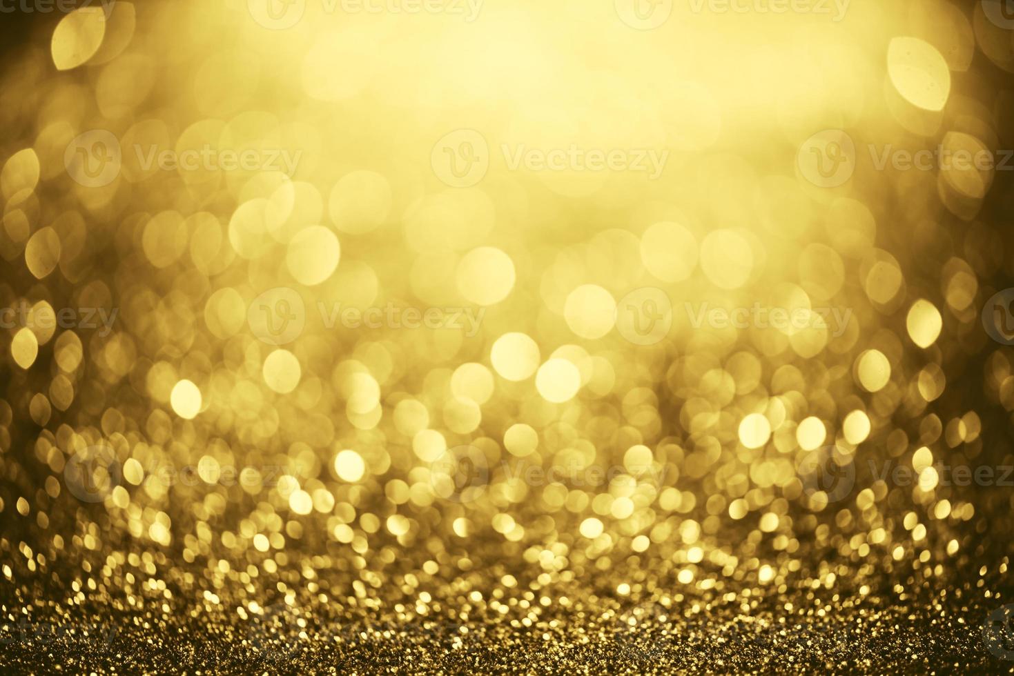 gouden glitter bokeh verlichting textuur wazig abstracte achtergrond voor verjaardag, jubileum, bruiloft, oudejaarsavond of kerst foto