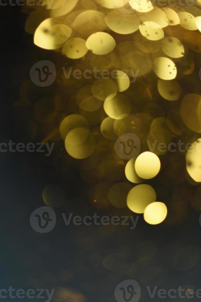 gouden glitter bokeh verlichting textuur wazig abstracte achtergrond voor verjaardag, jubileum, bruiloft, oudejaarsavond of kerst foto