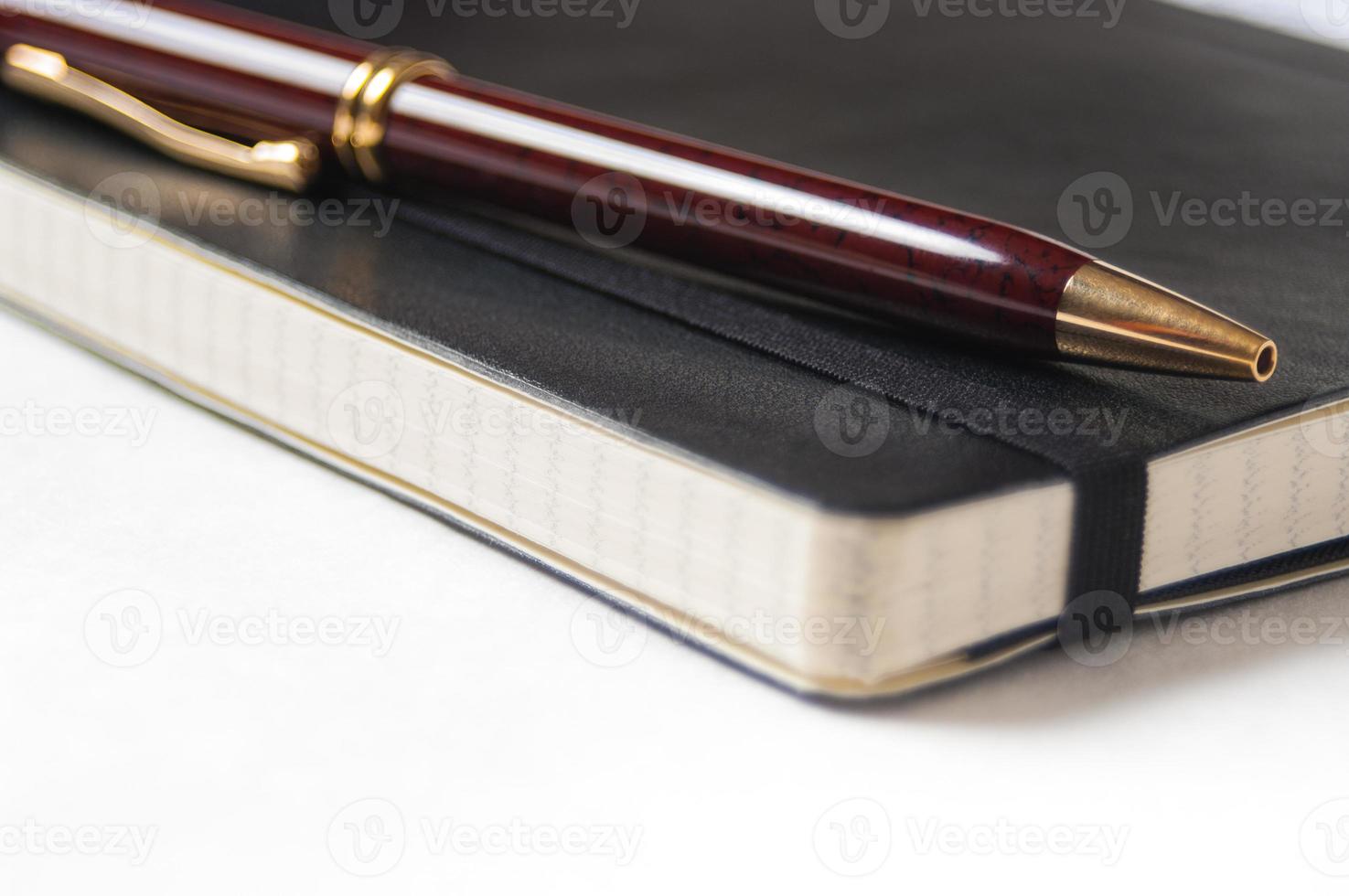 close-up van een pen en een notebook foto