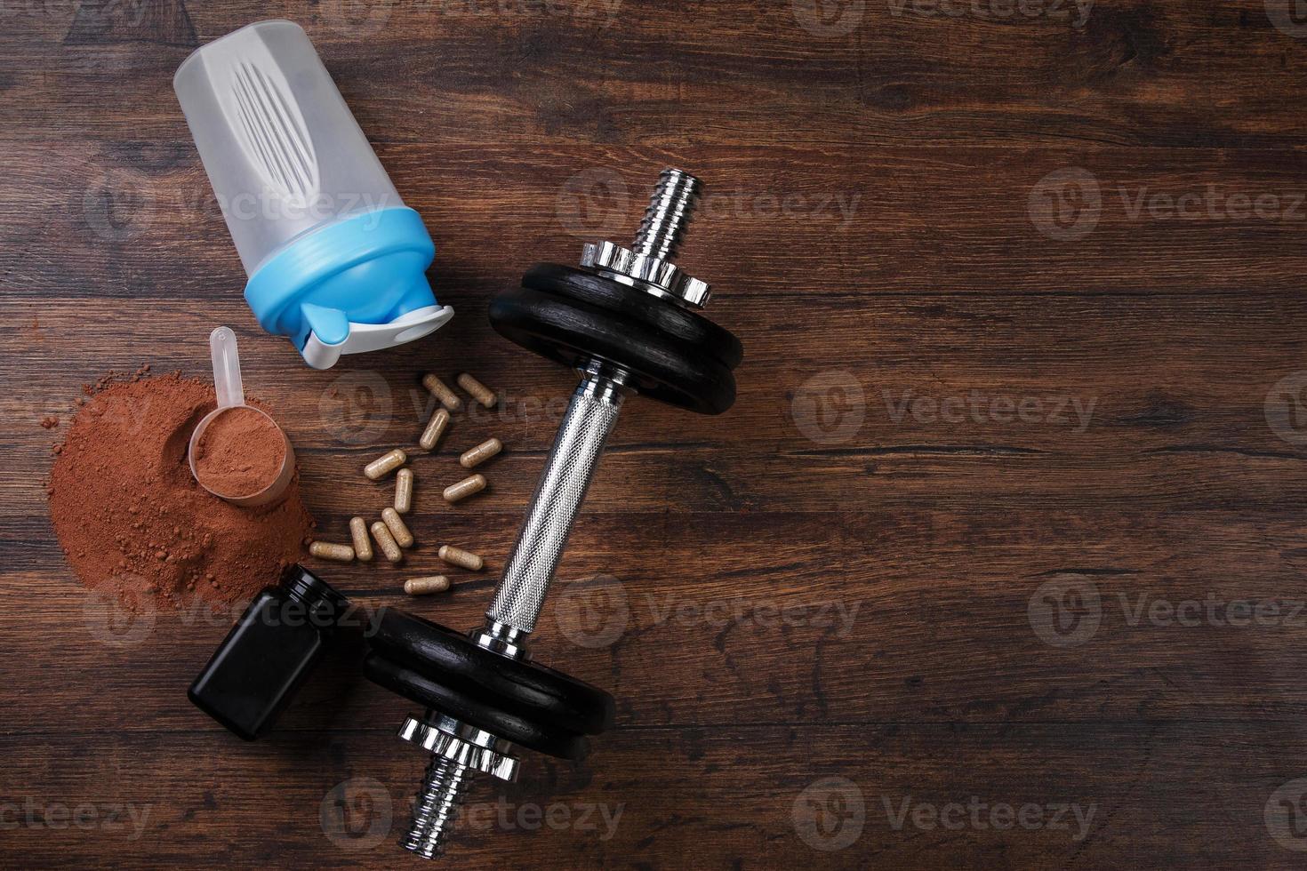 dumbells en voedingssupplementen foto