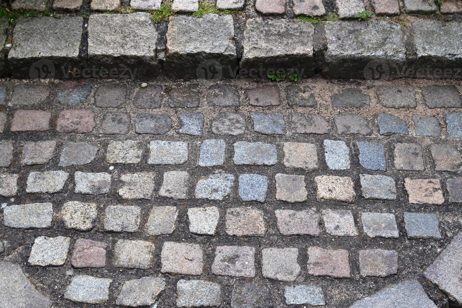 gedetailleerde close-up op oude historische geplaveide wegen en voetpaden foto