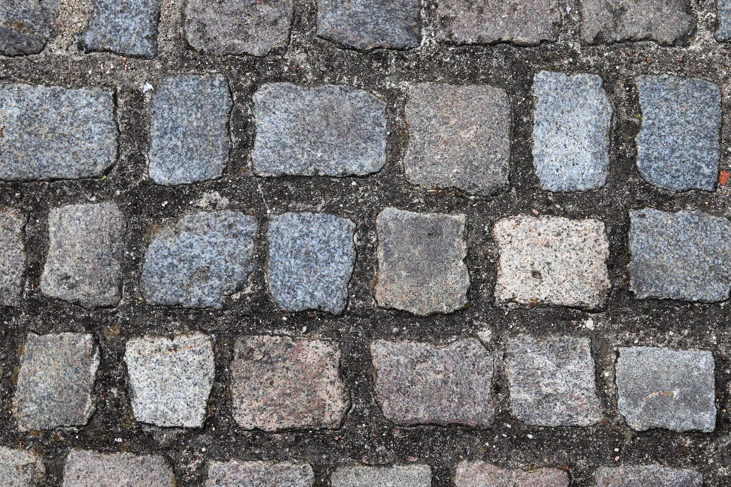 gedetailleerde close-up op oude historische geplaveide wegen en voetpaden foto