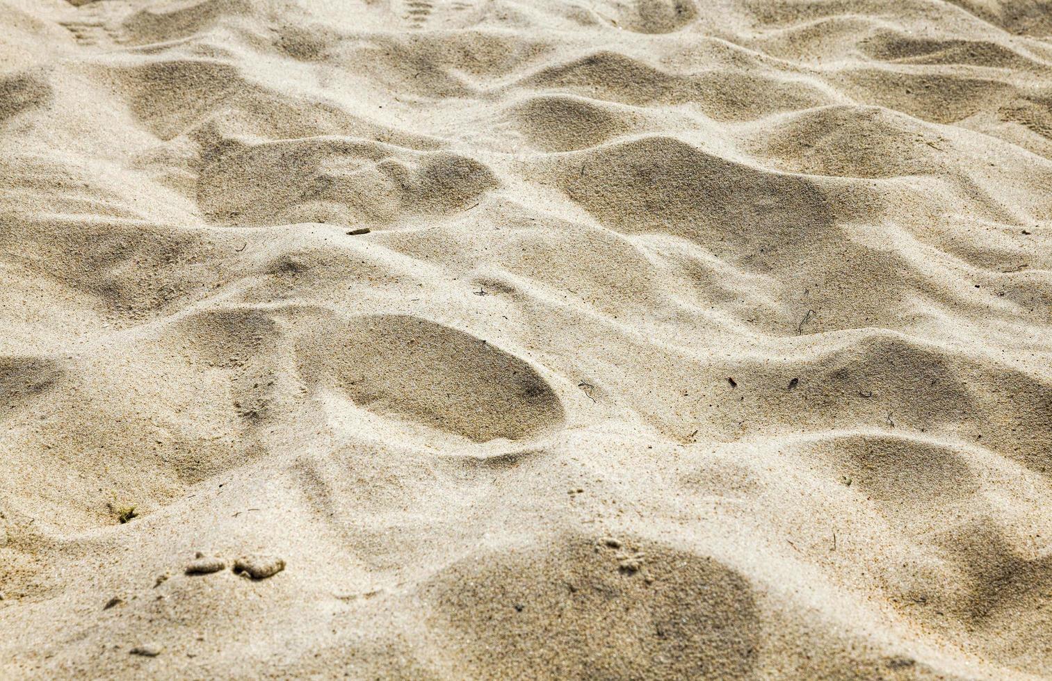 golvende ongelijke structuur van zand foto