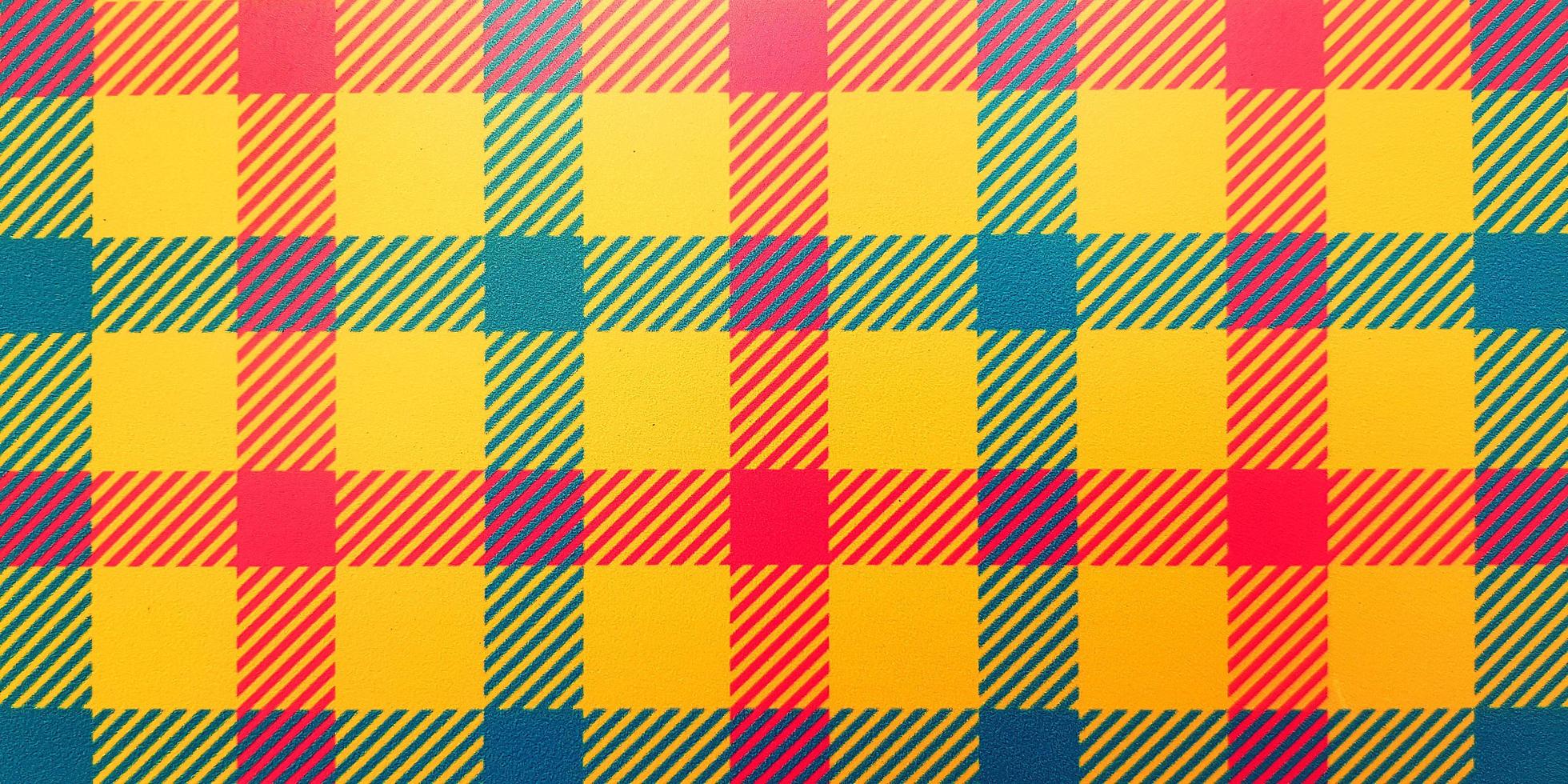 kleurrijke kunst van geruite lijn achtergrond. naadloos patroon met rood, geel en groen behang. foto