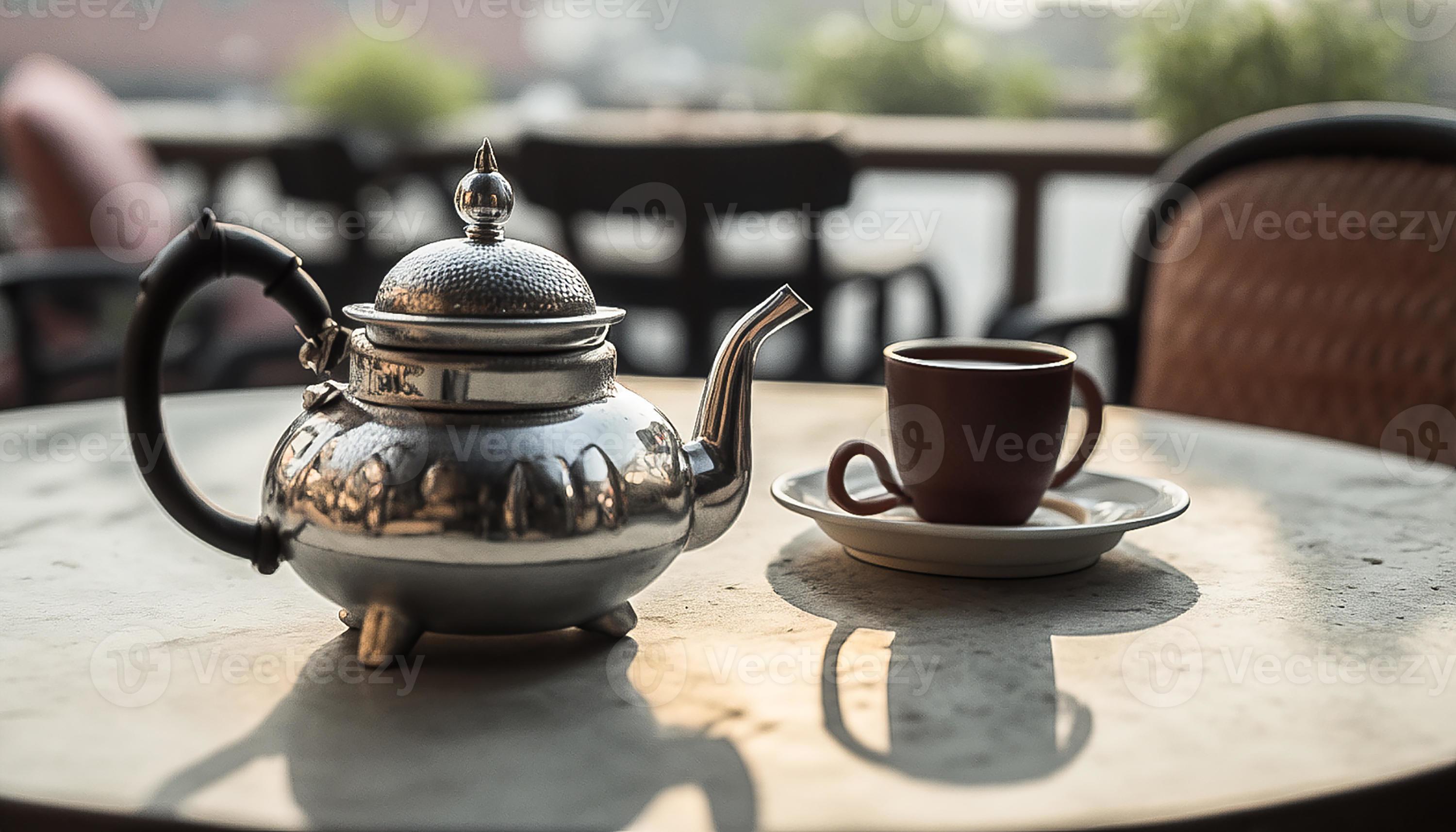 een van thee en thee waterkoker Aan de tafel Aan een op het dak 21091523 stockfoto bij Vecteezy