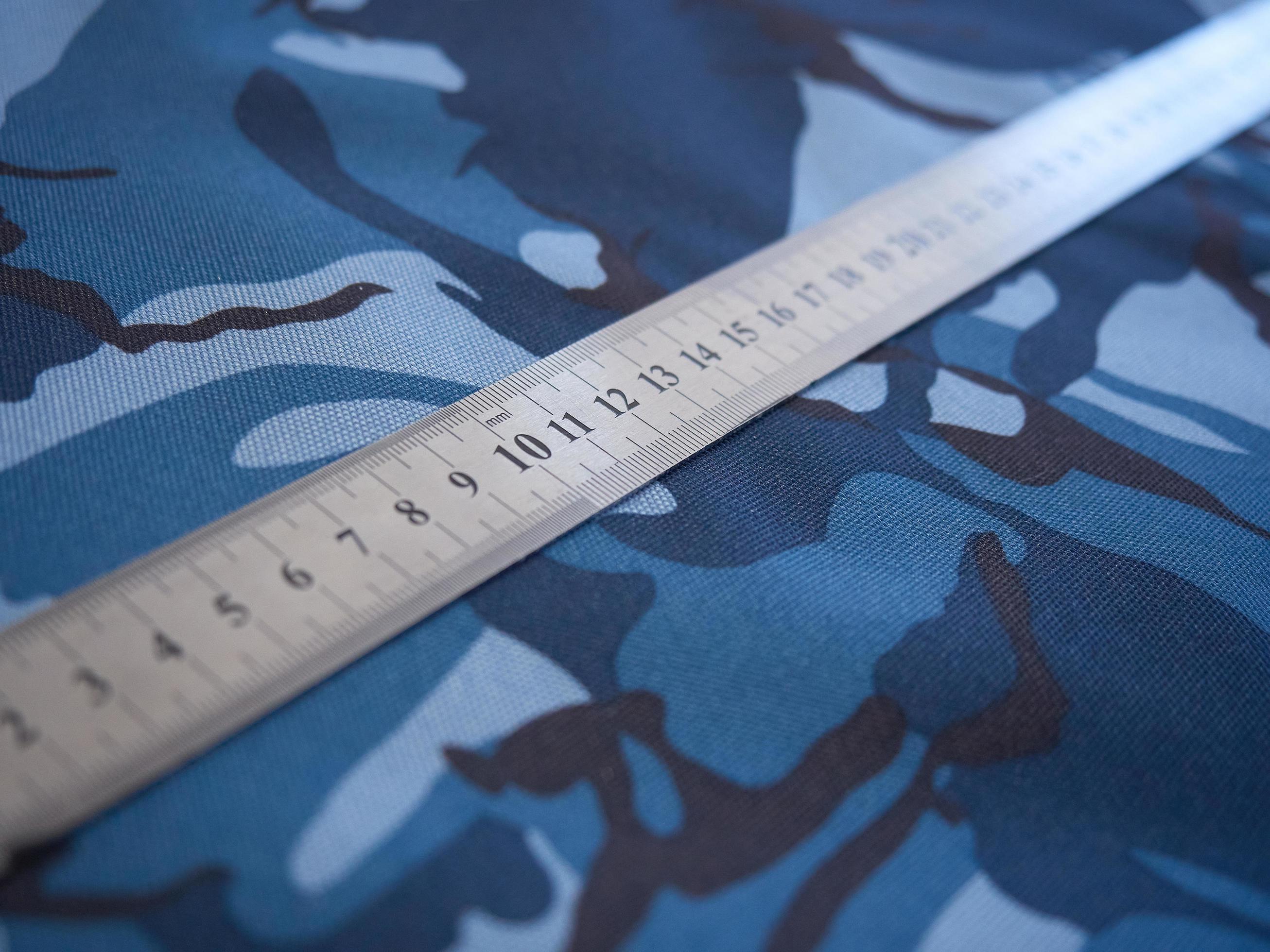 specificatie Verenigde Staten van Amerika halfrond camouflagestof met een liniaal erop 2224147 Stockfoto