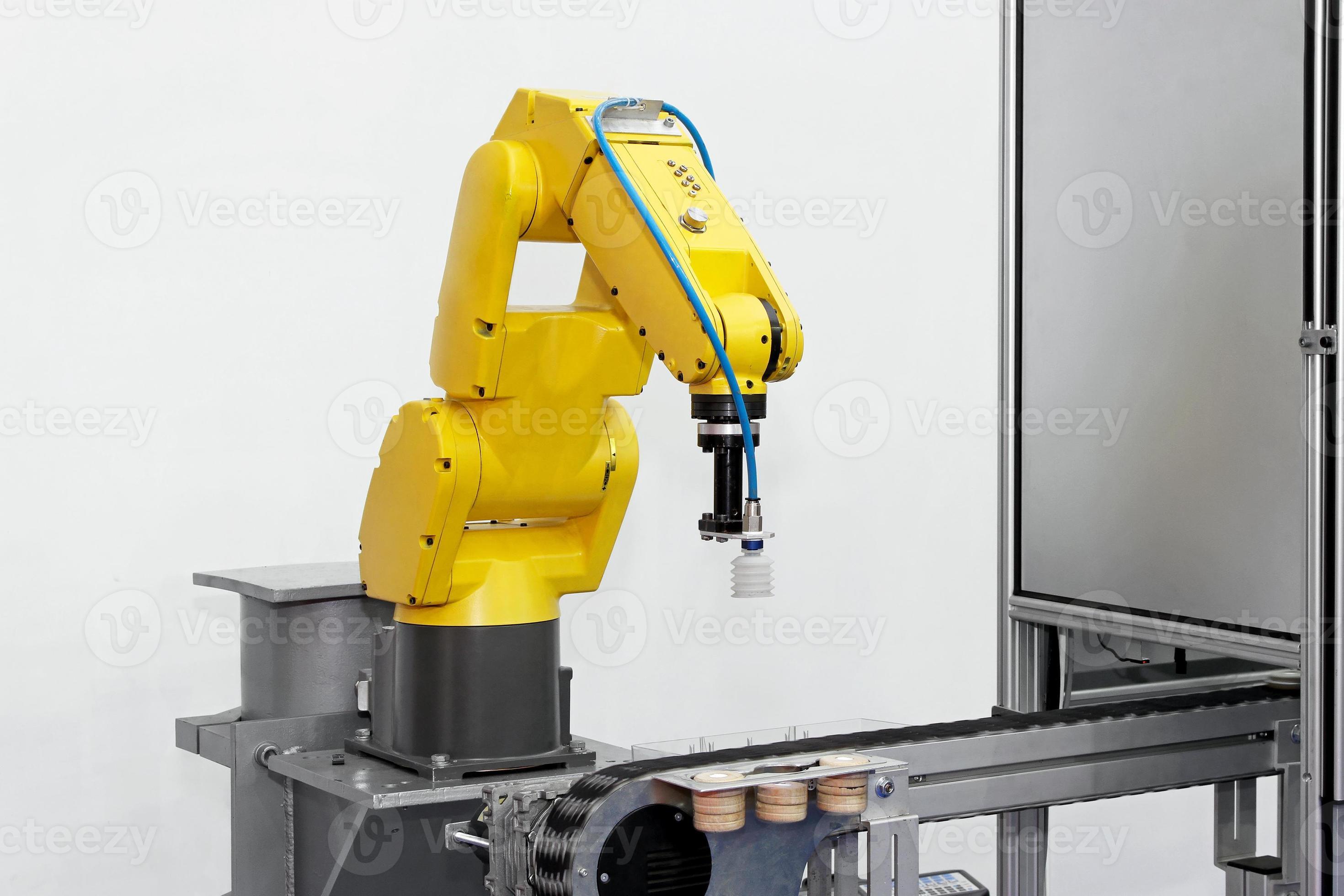 afbeelding van een robotarm van een productlijn foto
