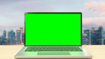 de notebook geeft een groen scherm weer op het dakgebouw voor het huidige concept 3D-rendering foto