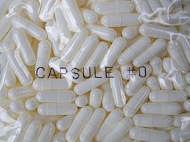 de afbeelding van de witte capsules voor medische en wetenschappelijke inhoud foto