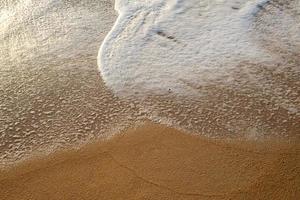 achtergrond op zandstrand foto