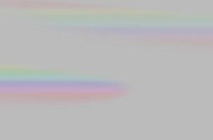 samenvatting van wazig regenboogprisma lichte overlay op grijze achtergrond voor mockup en decoratief foto