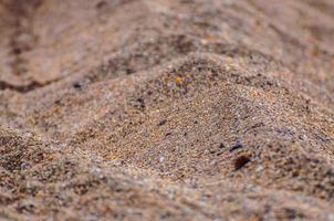 close-up van zandpatroon op het strand foto