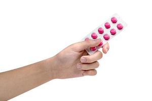 hand- Holding blaar pak van roze tablets pil geïsoleerd Aan wit achtergrond ,erbij betrekken knipsel pad foto