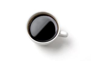 zwart koffie in de wit koffie kop foto