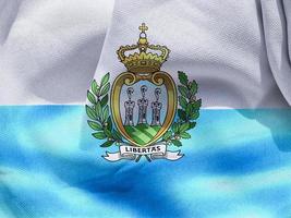 3D-illustratie van een vlag van San Marino - realistische wapperende stoffen vlag foto