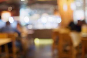 vervagen klanten in café restaurant of coffeeshop abstracte achtergrond met bokeh licht foto