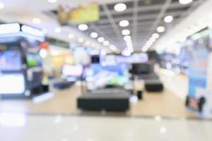 elektronisch warenhuis toont televisie-tv en huishoudapparatuur met bokeh licht wazige achtergrond foto