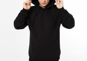 middelbare leeftijd Mens in een zwart met een kap sweater looks naar beneden - voorkant visie, bespotten omhoog bijgesneden beeld foto