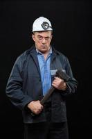 mijnwerker met een voorhamer foto
