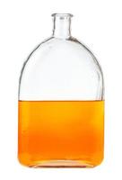 oplossing van oranje waterverf in glas fles foto