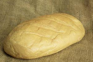 vers handgemaakt brood Aan zak achtergrond foto