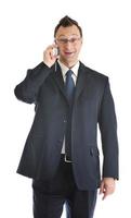 een zakenman met mobiele telefoon geïsoleerd Aan wit foto