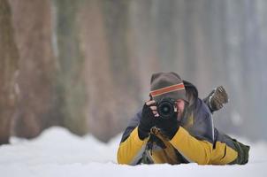 fotograaf in sneeuw foto