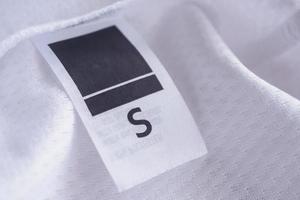 kledinglabel op sport textiel voetbalshirt achtergrond foto