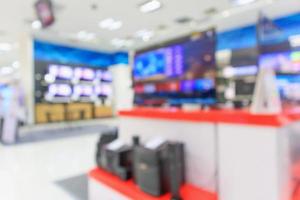 elektronisch warenhuis toont televisie-tv en huishoudapparatuur met bokeh licht wazige achtergrond foto