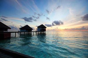 Maldivische huizen op zonsopgang