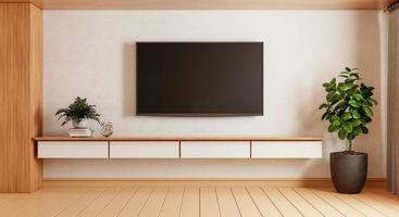 tv boven houten kast in moderne lege ruimte met planten tapijt op houten ondergrond. thema in Japanse stijl. architectuur en interieurconcept. 3D illustratie weergave foto