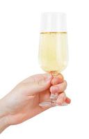 hand- houdt wijnglas met Champagne foto