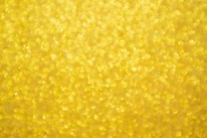 abstracte gouden glitter feestelijke kerst textuur achtergrond vervagen met bokeh licht foto