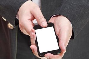telefoon met besnoeiing uit scherm in zakenman hand- foto