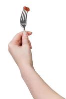 hand- Holding dineren vork met gespietst bruin Boon foto