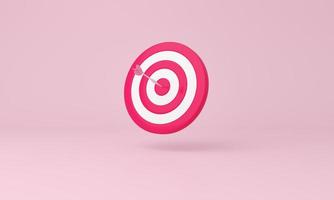 pijl raken de centrum van doelwit Aan roze achtergrond. bedrijf het richten Bij de doelwit concept. foto