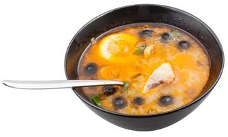 bovenstaand visie van solyanka vis soep in kom met lepel foto