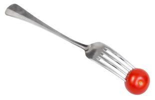vork met een vers kers tomaat geïsoleerd foto