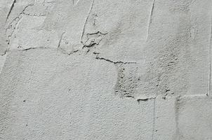 de structuur van de muur, gedekt met grijs schuim polystyreen platen, welke zijn besmeurd met een versterken mengsel. stadium van muur isolatie foto