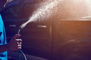 hand- Holding auto wassen slang foto