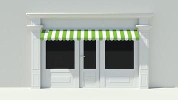zonnige winkelpui met grote ramen met witte winkelgevel foto
