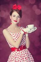 mooie roodharige vrouwen met kopje thee.