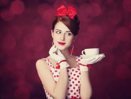 mooie roodharige vrouwen met kopje thee.