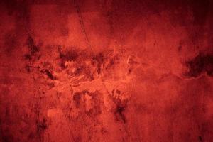 eng donker rood grunge muur beton cement structuur achtergrond foto