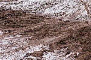 vuil modder weg achtergrond Bij winter met selectief focus en vervagen foto