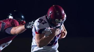 Amerikaans Amerikaans voetbal spelers in actie foto