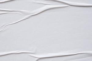 wit verfrommeld en gevouwen papier poster structuur achtergrond foto